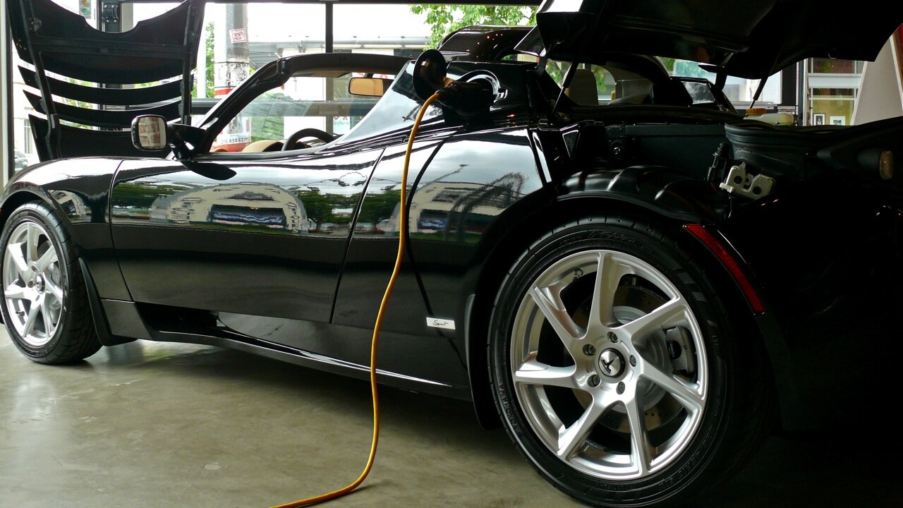 A Tesla plugged in at the Seattle showroom