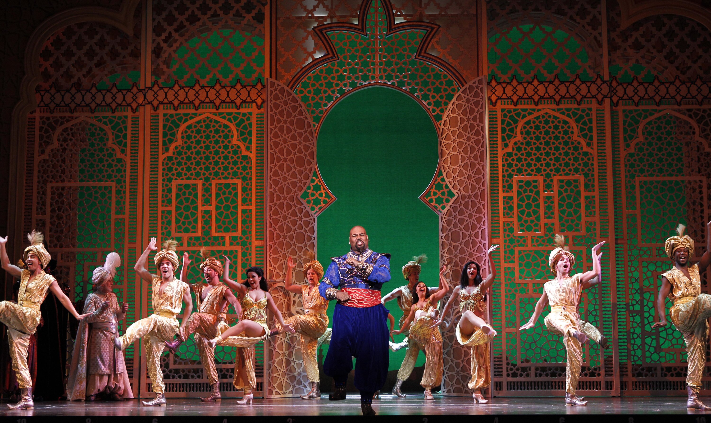 Photo: James Monroe Iglehart (center) as the Genie with the company of The 5th Avenue Theatre’s production of Disney’s Aladdin. (Photo: Chris Bennion)