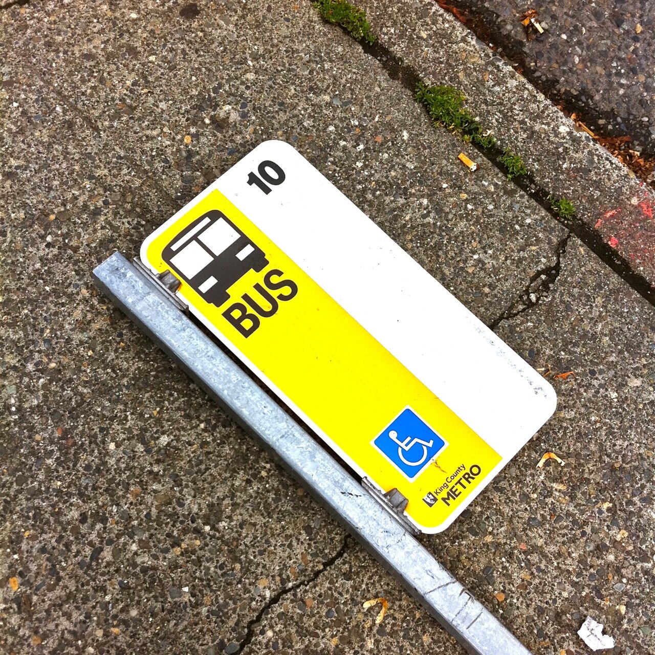 Metro hasn't had the money or time to replace this downed bus stop sign. (Photo: MvB)