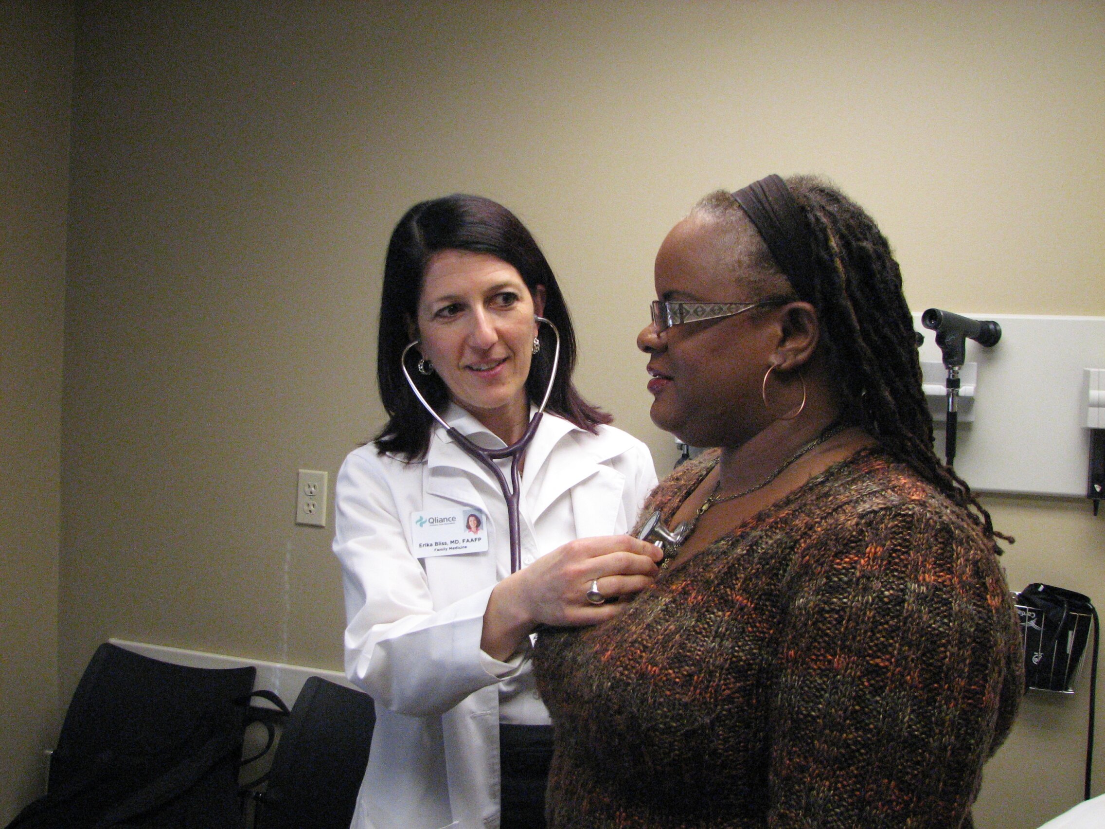 CEO Dr. Erika Bliss caring for a patient at Qliance's Seattle clinic
