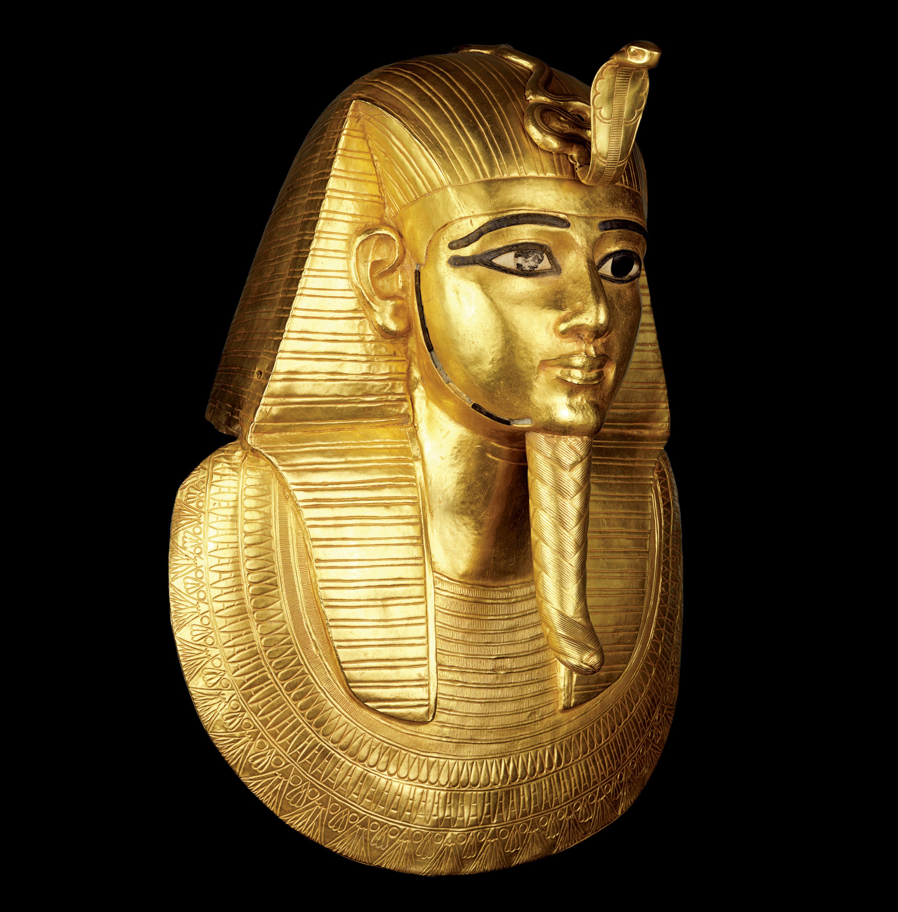 Funerary Mask of Psusennes I: The golden mask lay over the head, chest and part of the shoulders of the mummy of Psusennes, as a layer of protection. The royal headdress with ureaus cobra and the divine false beard he wears attested to his royal and godly status. The use of gold, considered the flesh of the gods, reaffirmed his divinity in the afterlife. All photographs © Sandro Vannini, care of National Geographic.