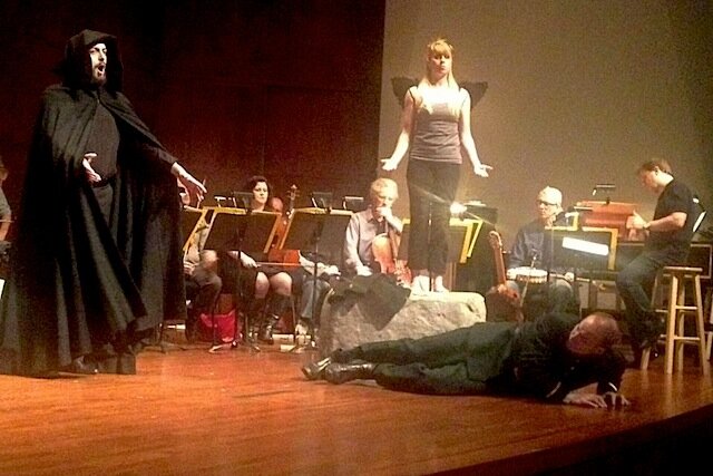 Rehearsal of MOR's The Emperor of Atlantis: Death (, left) confronts the Emperor (Victor Benedetti, on the floor)